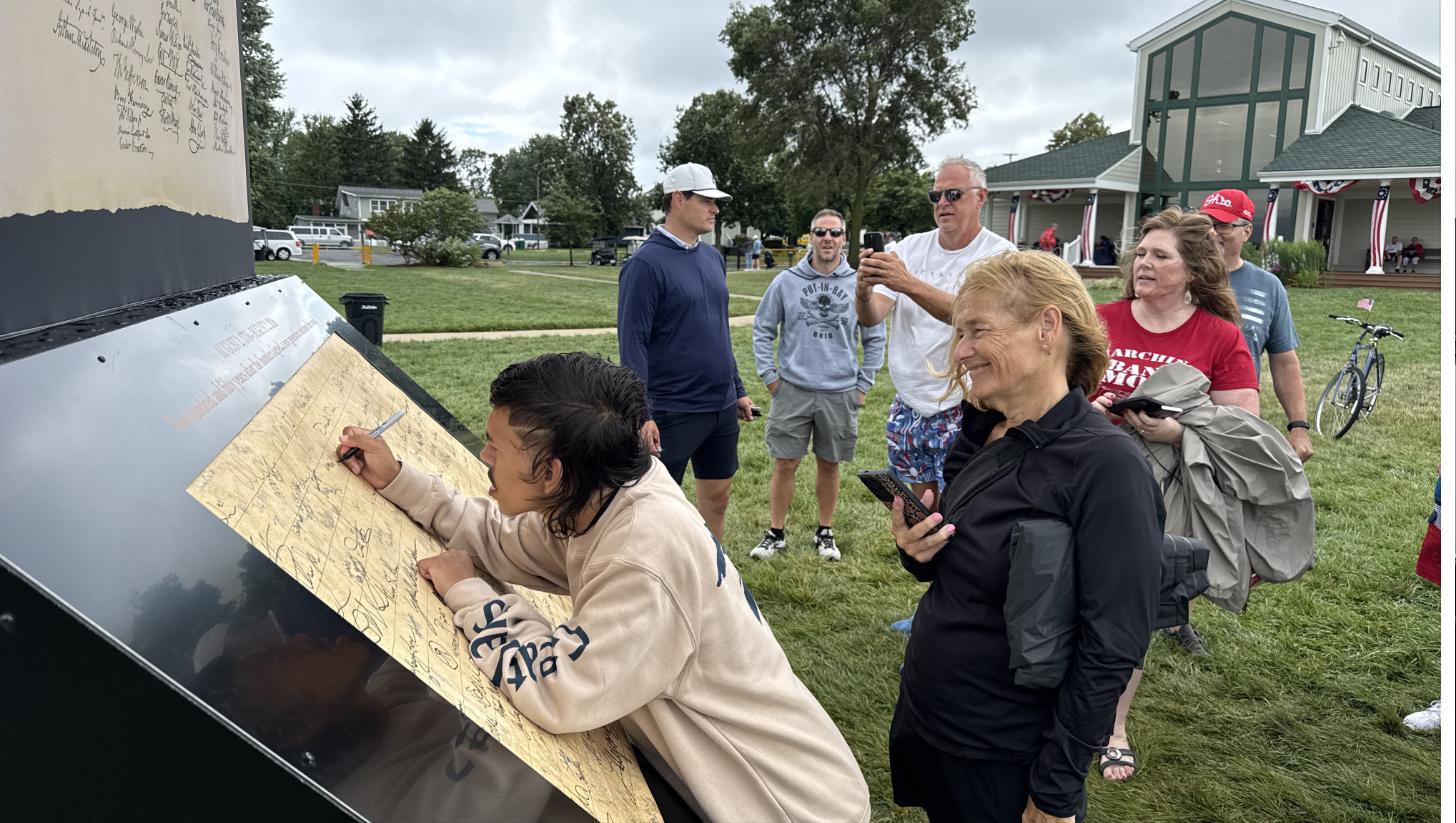 Attendees signing the Declaration at Freedom Village